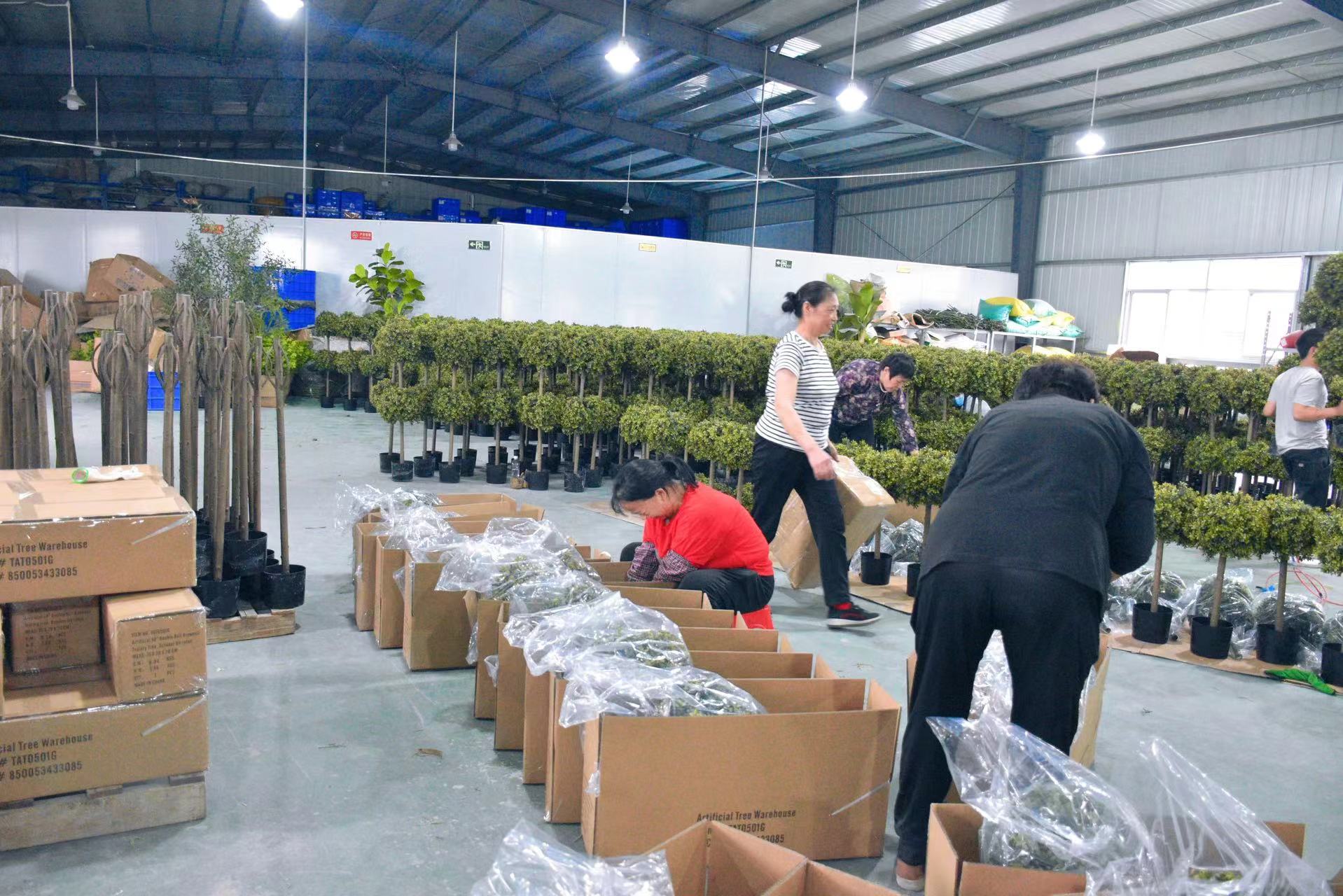 Secure Product Packaging of Faux plants in factory